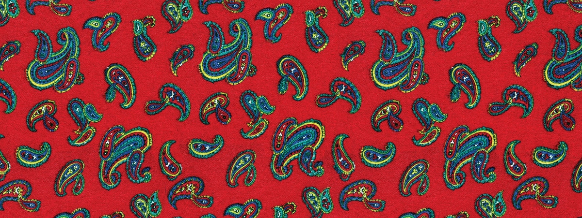 A retro red 80s paisley-style fabric swatch
